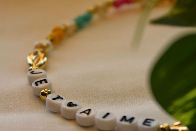 Bracelet with a name on a string